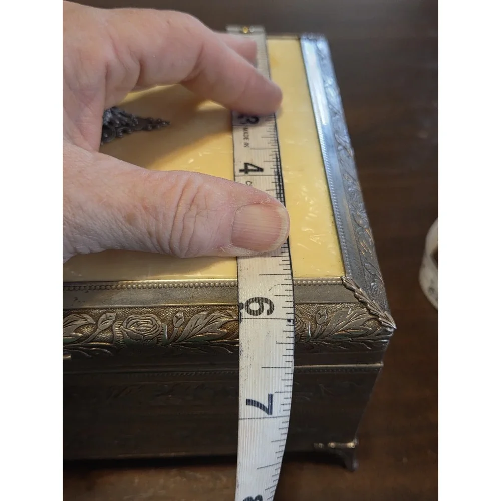 antique etched brass trinket box features a hinged lid Music Box